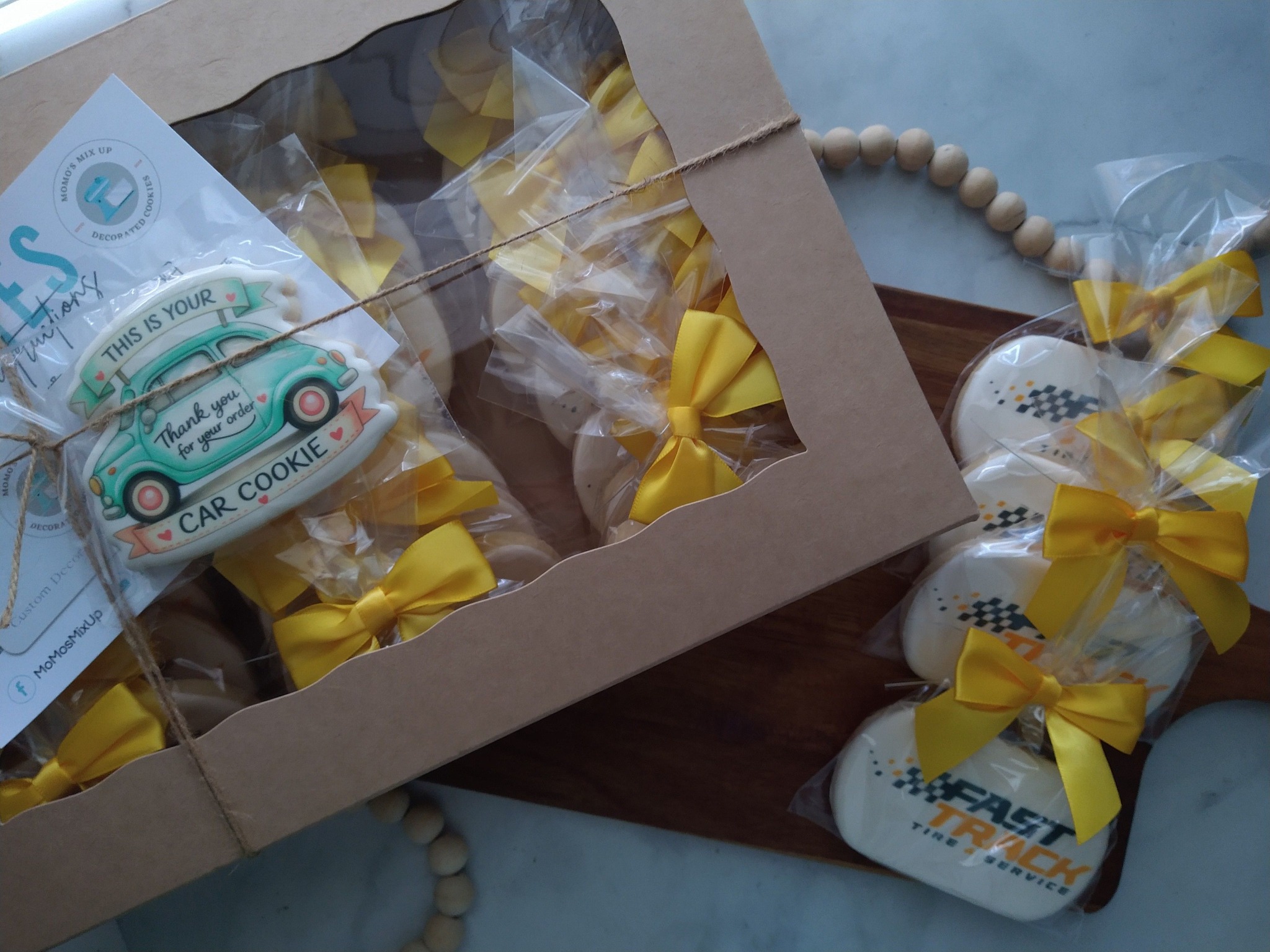 Individually wrapped thank you cookies for Fast Track with yellow bows and boxed presentation