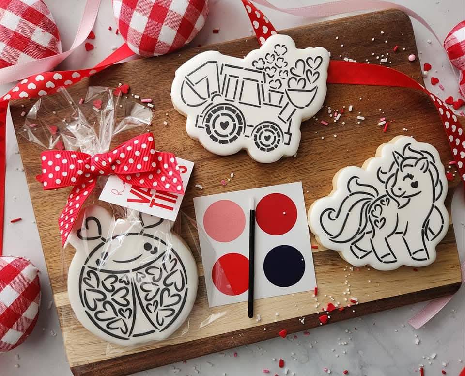 Paint-your-own cookie kit with outlined cookies, edible paint palette, and brush